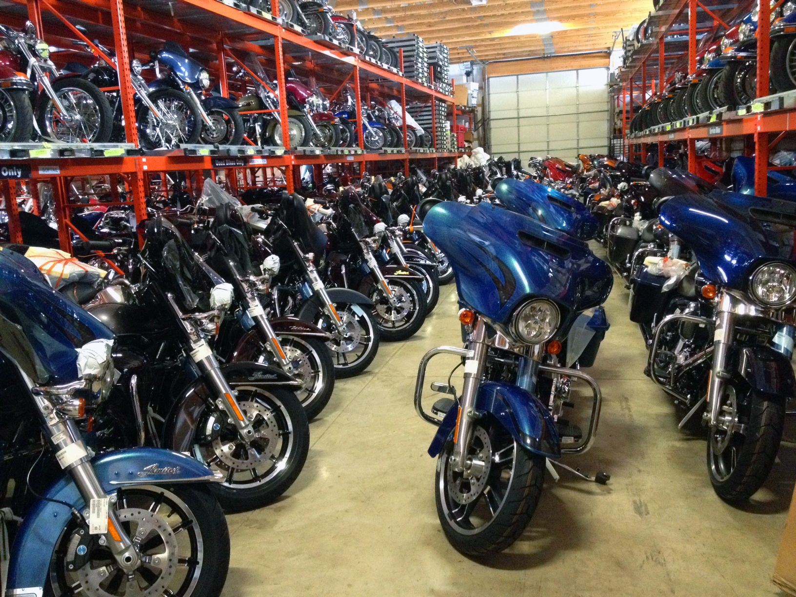 A view of a Harley-Davidson motorcycle waiting in the bowels of a warehouse for its forever home