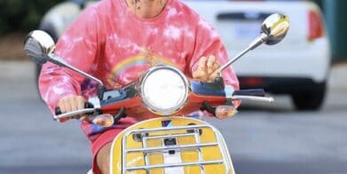 A view of Bieber riding his scooter