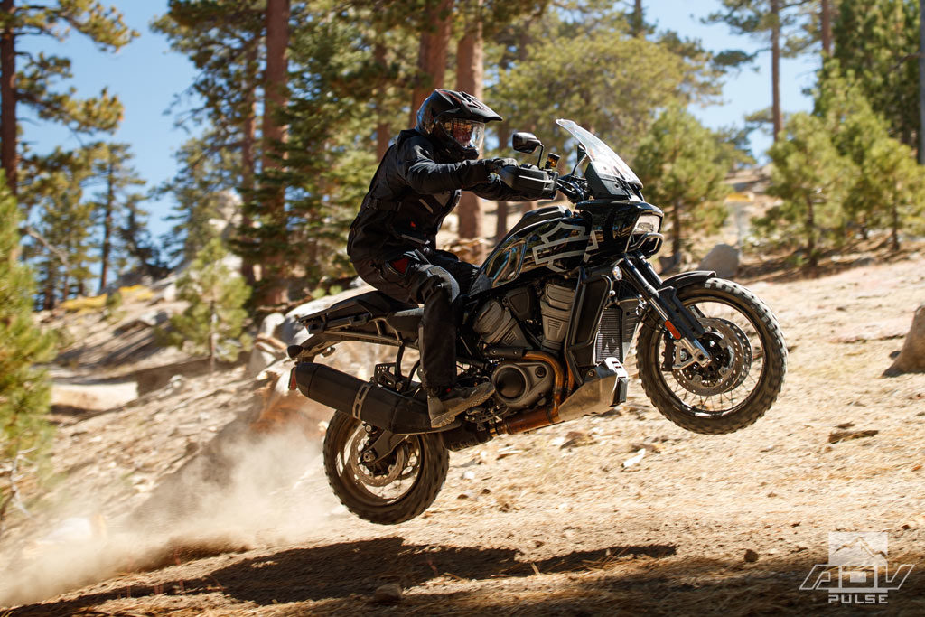 A view of a Harley-Davidson Pan America skipping and jumping through dirt like an expensive little elf.