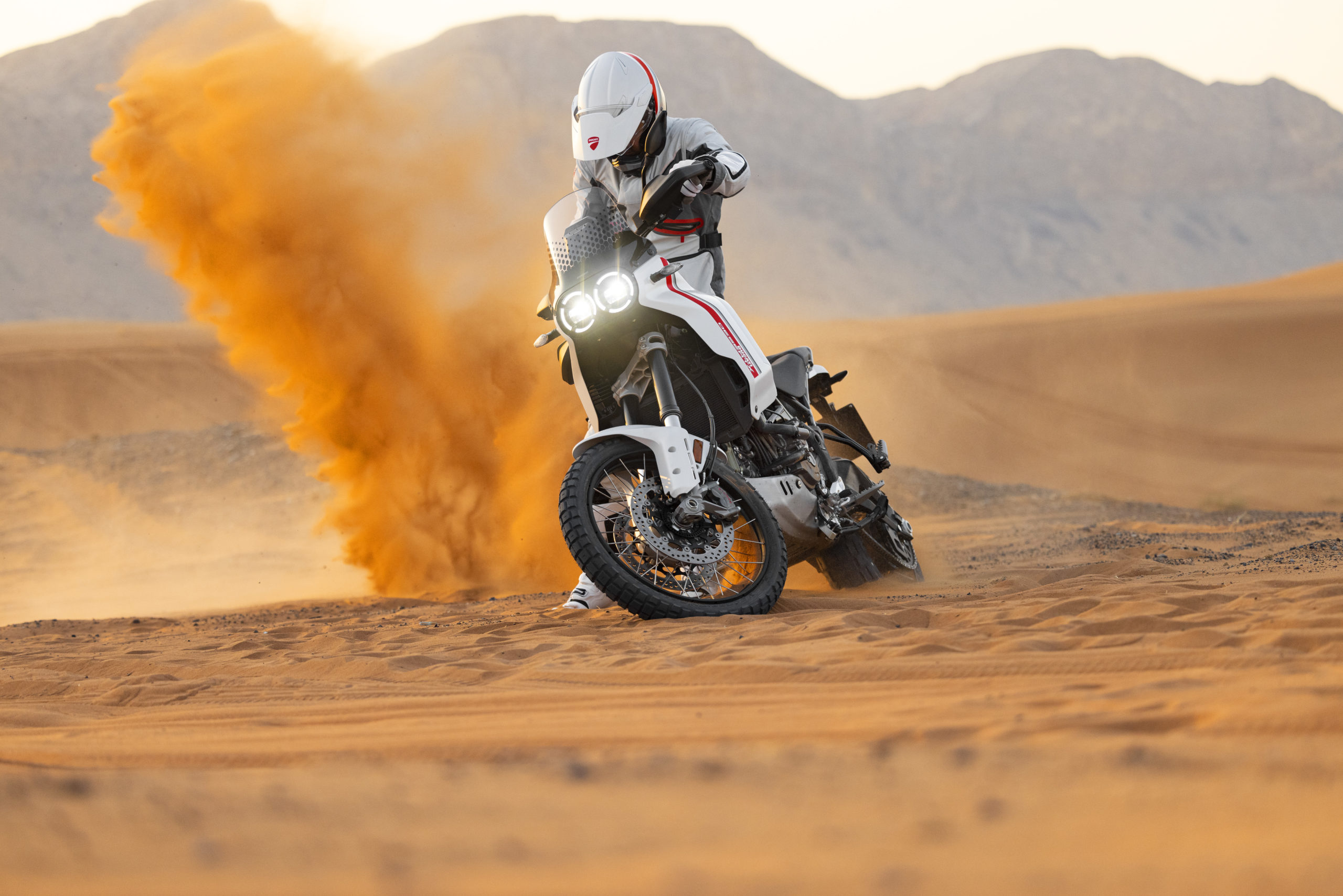 A view of the Ducati DesertX being ridden in the desert