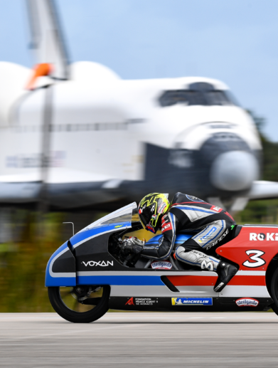 A view of the Voxan team working at and successfully blasting through 21 electric motorcycle speed records on Space Florida’s Launch and Landing Facility