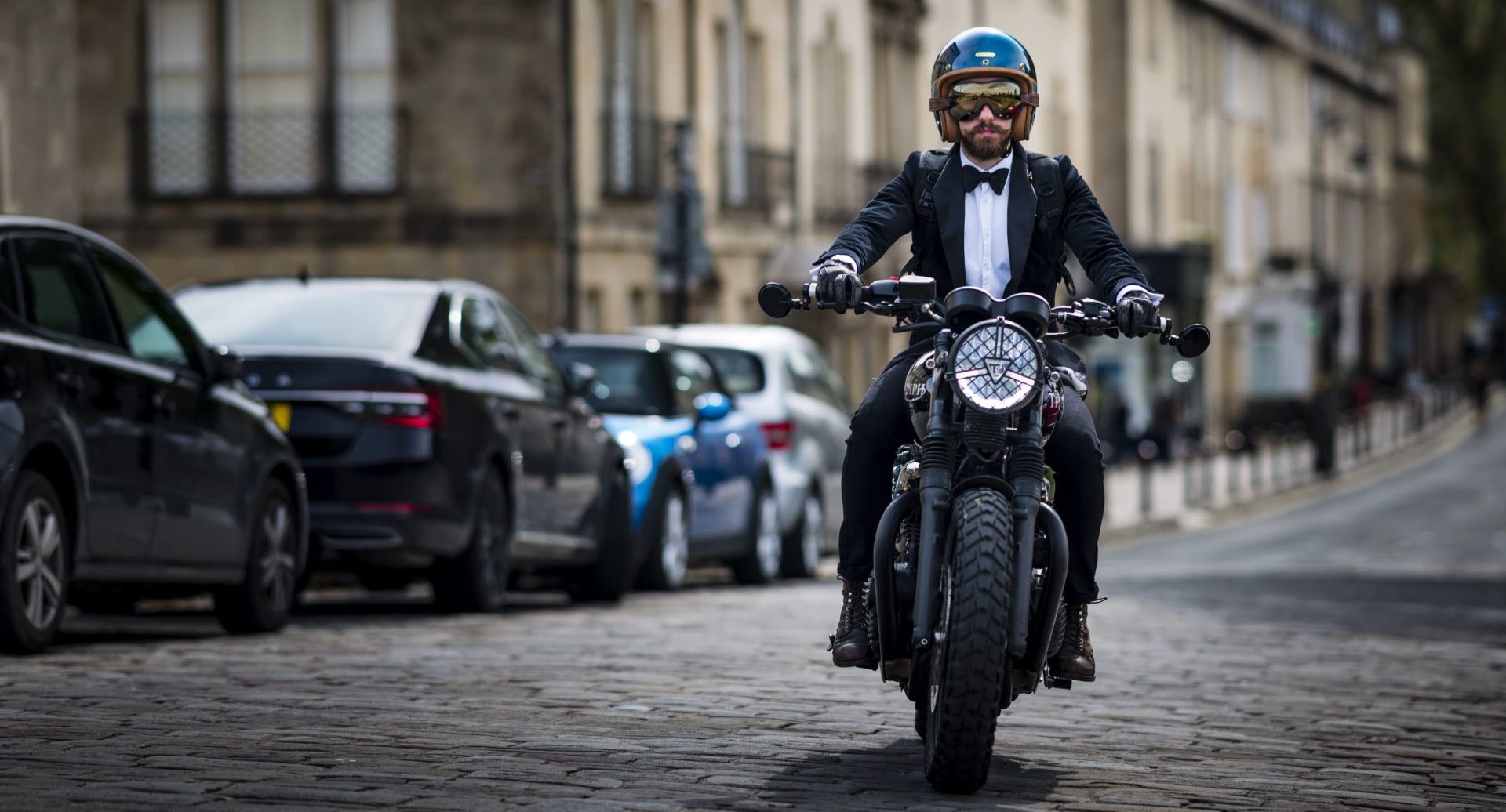 A picture of a man enjoying his Distinguished gentleman's ride on a triumph motorcycle