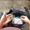 A view of an Apple AirTag next to a motorcycle