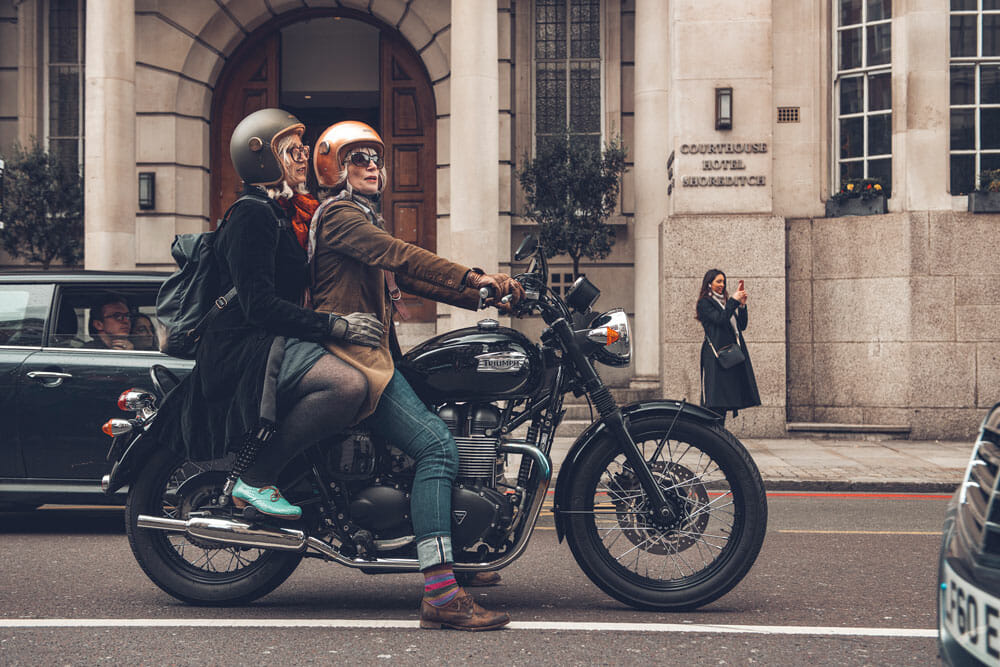 two riders enjoying a ride on a triumph motorcycle