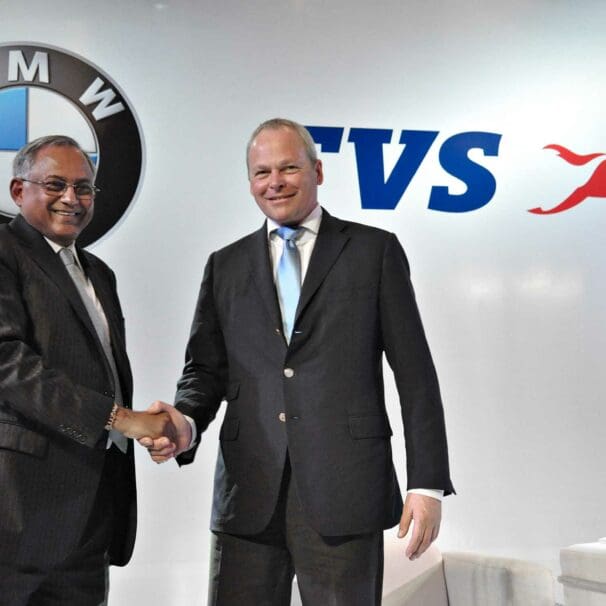 A view of the BMW and TVS logos together, in symbolism of the upcoming partnership between the two companies