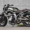 A 2006 Kawasaki ER-6F that's been tricked out with a retro, cafe racer flair