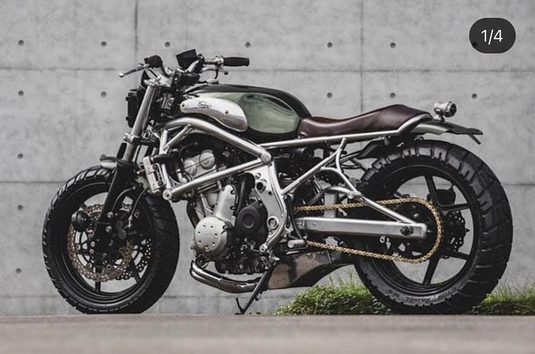 A 2006 Kawasaki ER-6F that's been tricked out with a retro, cafe racer flair