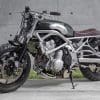 A 2006 Kawasaki ER-6F that's been tricked out with a retro, cafe racer flair