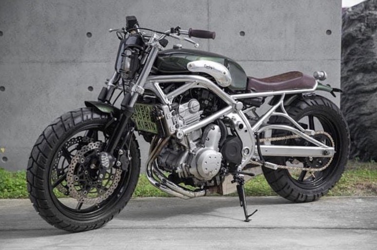 A 2006 Kawasaki ER-6F that's been tricked out with a retro, cafe racer flair