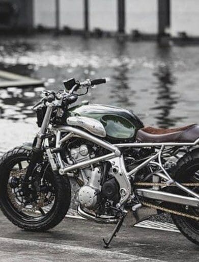 A 2006 Kawasaki ER-6F that's been tricked out with a retro, cafe racer flair