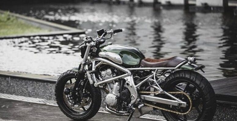 A 2006 Kawasaki ER-6F that's been tricked out with a retro, cafe racer flair