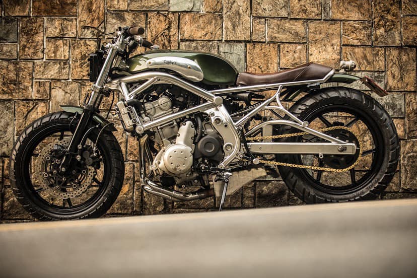 A 2006 Kawasaki ER-6F that's been tricked out with a retro, cafe racer flair