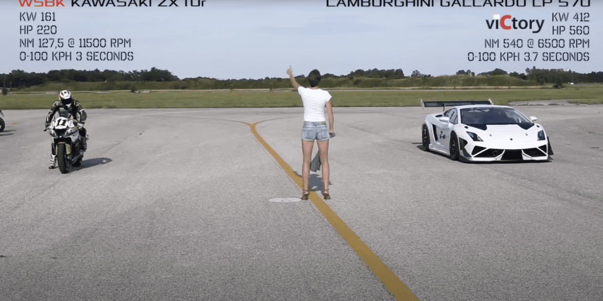 A view of a woman flagging the start of a drag race held in Germany