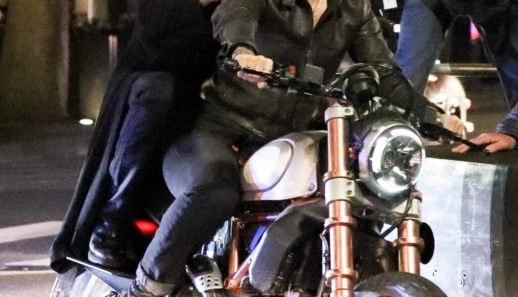 A view of Reeves and Carrie-Anne trying out a Ducati bike for the Matrix