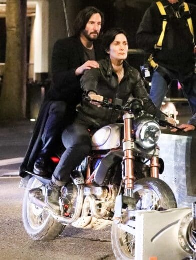 A view of Reeves and Carrie-Anne trying out a Ducati bike for the Matrix