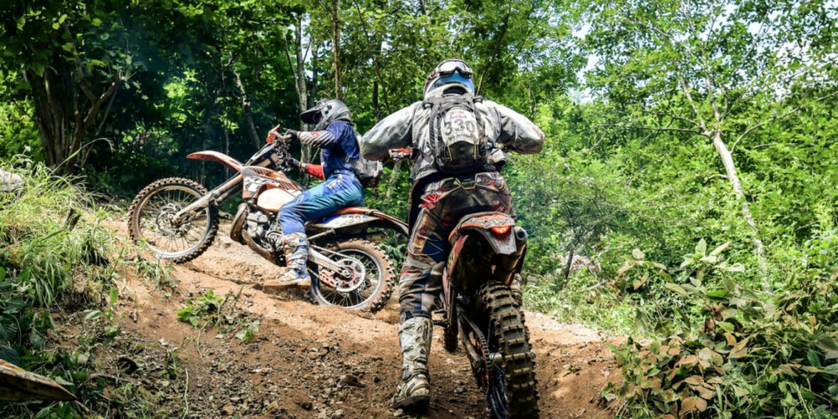 A view of a set of youngsters using a trail for scrambler riding