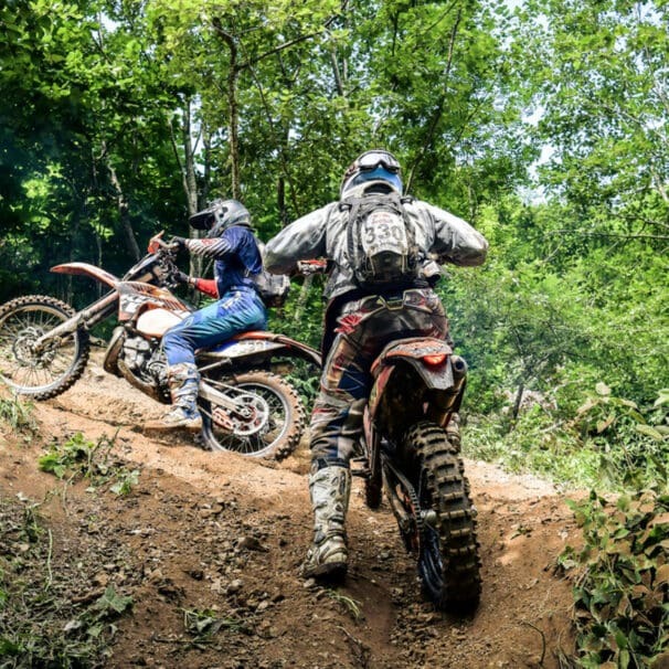 A view of a set of youngsters using a trail for scrambler riding