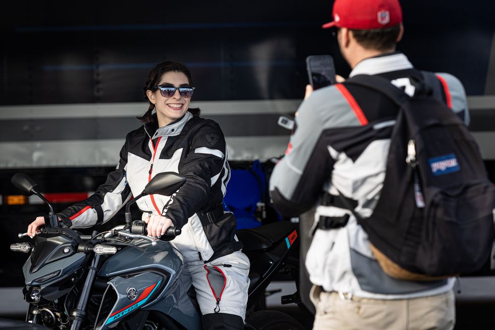 A view of a girl trying out a motorcycle at the 2021 Progressive IMS Outdoor Expo