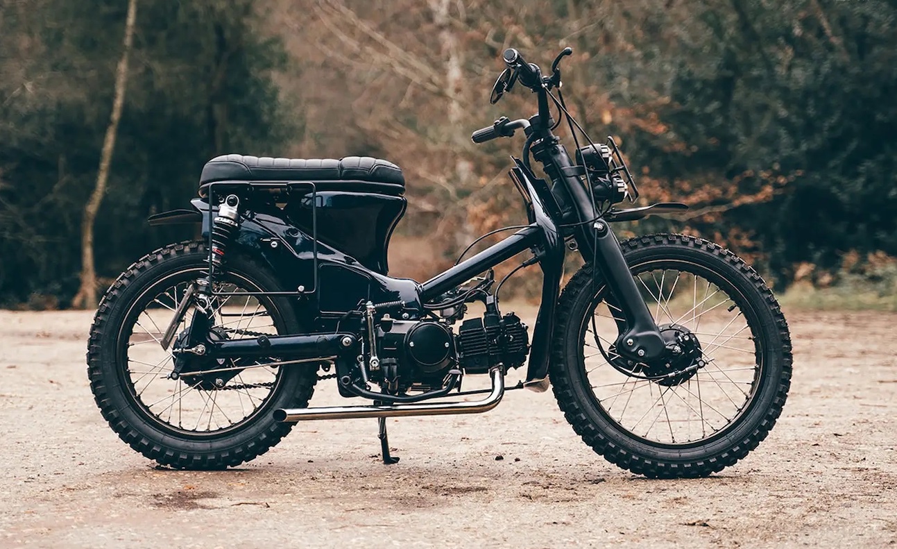 A view of a custom Honda Super Cub that has been customized by Scar's Motorcycles