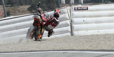 A view of the racers at MotoAmerica using the flimsy soft barriers for motorcycle accidents