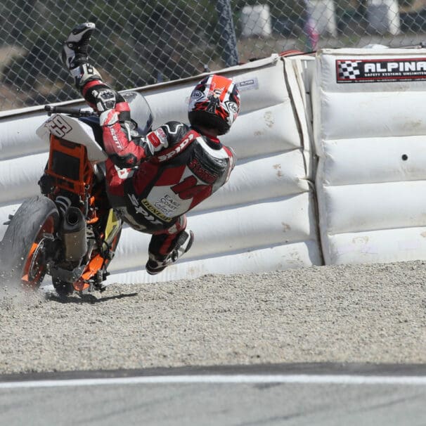 A view of the racers at MotoAmerica using the flimsy soft barriers for motorcycle accidents