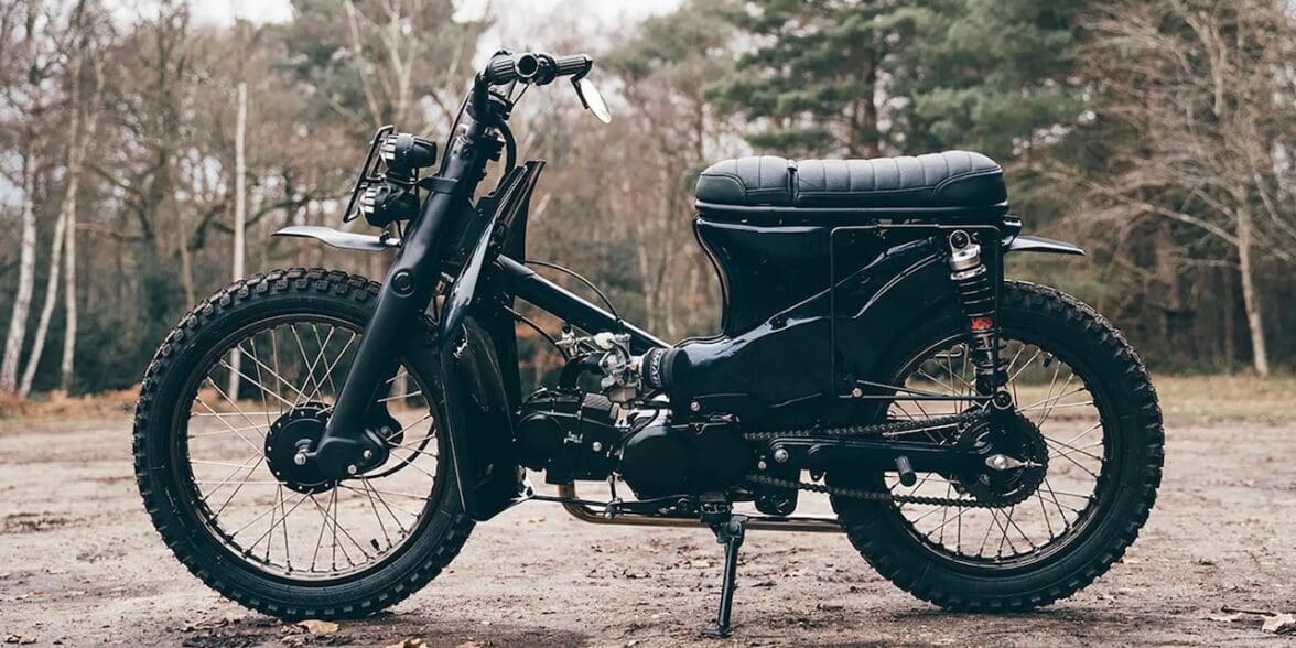 A view of a custom Honda Super Cub that has been customized by Scar's Motorcycles