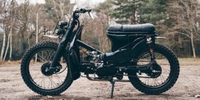 A view of a custom Honda Super Cub that has been customized by Scar's Motorcycles