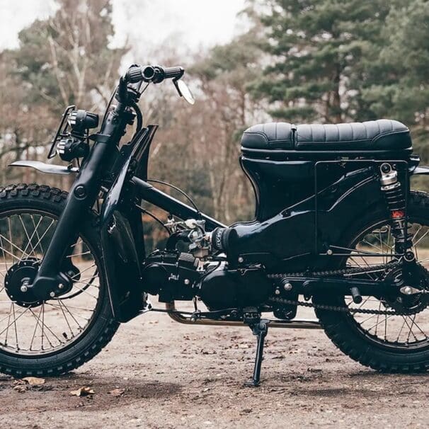 A view of a custom Honda Super Cub that has been customized by Scar's Motorcycles