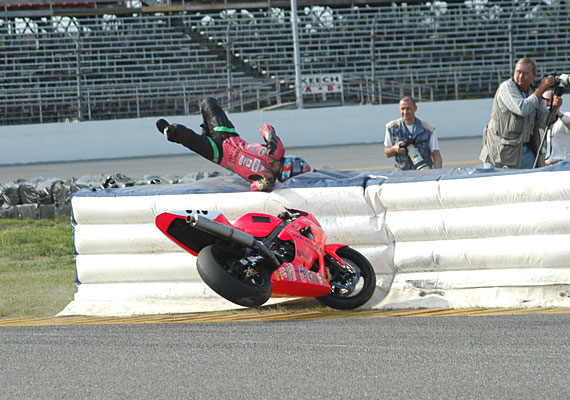 A view of the racers at MotoAmerica using the flimsy soft barriers for motorcycle accidents