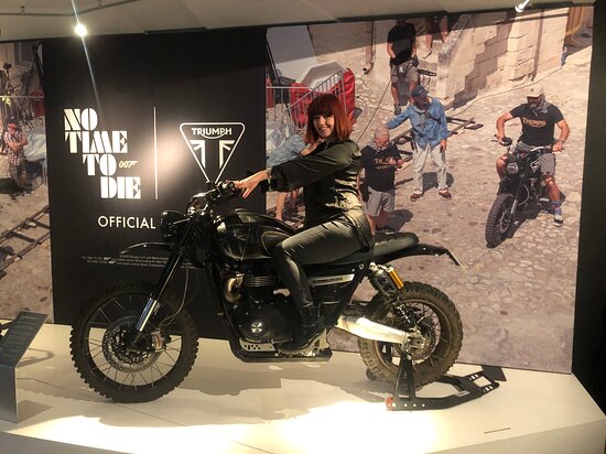 A woman on a triumph bike at the Triumph visitor experience centre
