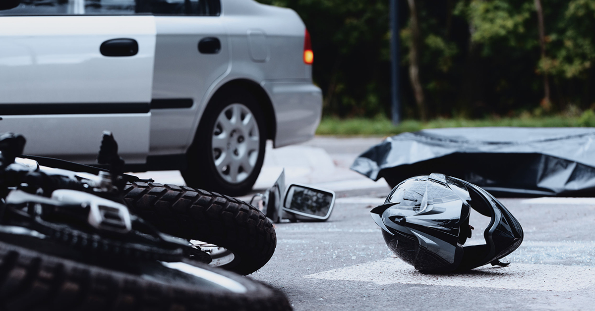 Motorcycle helmet on the street after a fatal accident with a car