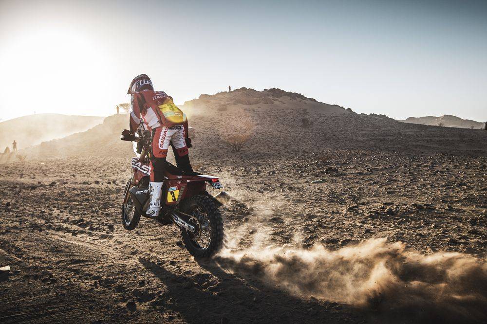 A Dakar motorcycle rider on some dunes in the 2022 Dakar Rally