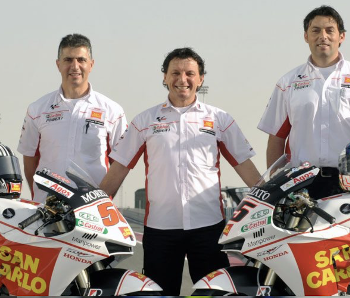 Gresini, founder of Gresini Racing, next to teammates