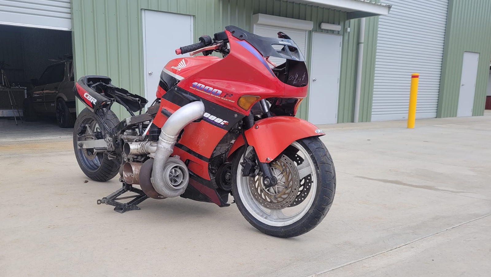 A view of a Honda CBR1000F Hurricane sporting a Honda minivan engine that's been turbo'ed