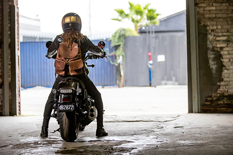 A view of a biker getting ready to head out on her two-wheeled machine