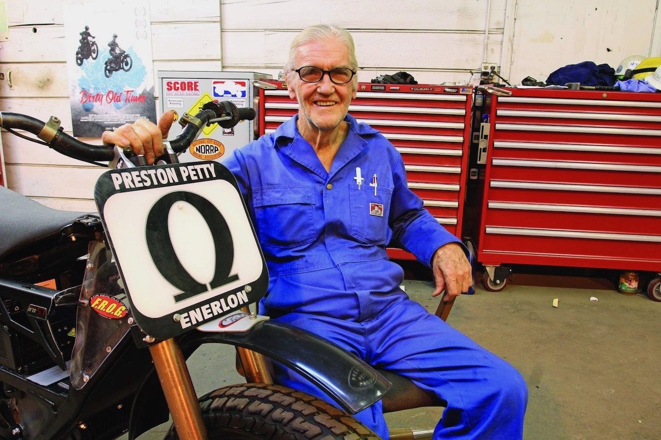 A view of Preston Petty next to one of his plastic fenders, created by his company, Petty Plastics