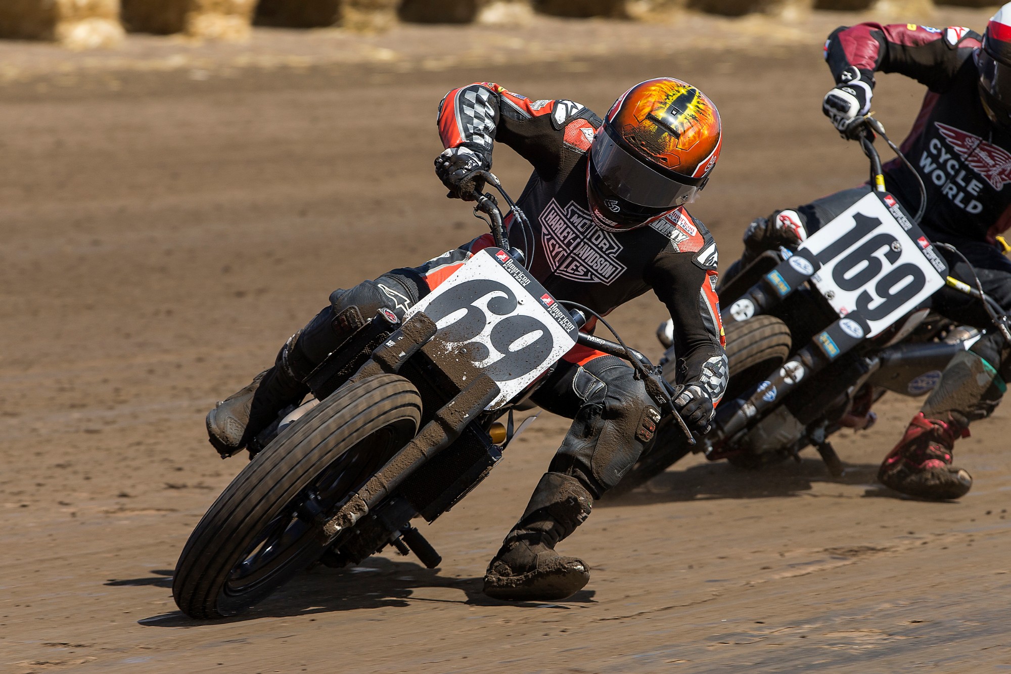 A view of the American Flat Track racers leaning into the curves