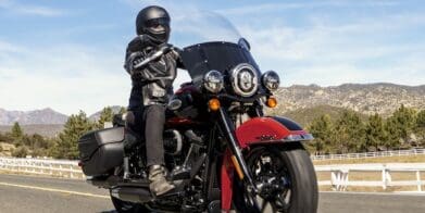 A view of a harley bike with rider enjoying the rugged topography