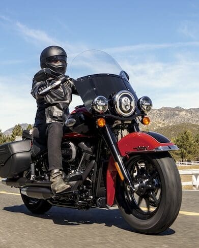 A view of a harley bike with rider enjoying the rugged topography