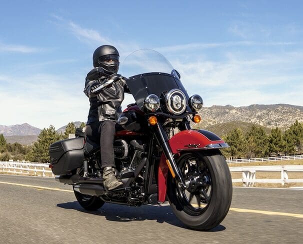 A view of a harley bike with rider enjoying the rugged topography