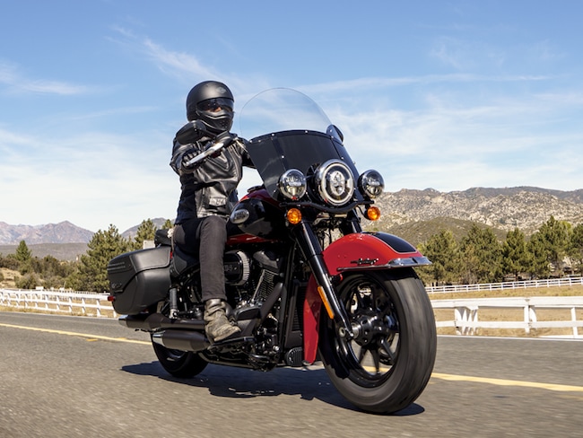 A view of a harley bike with rider enjoying the rugged topography