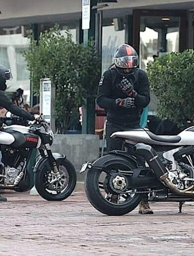 A view of Alex Winter and Keanu Reeves meeting for a cup of coffee on two arch motorcycles