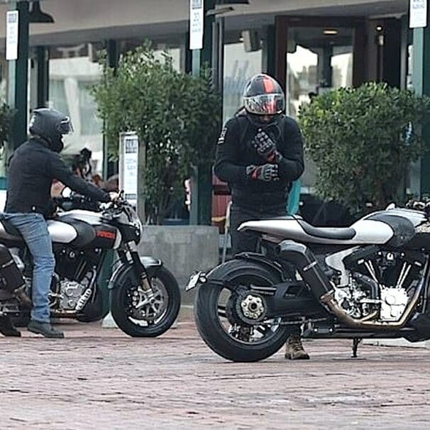 A view of Alex Winter and Keanu Reeves meeting for a cup of coffee on two arch motorcycles