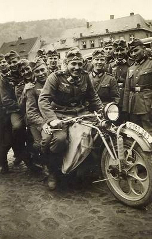 Böhmerland 600cc motorcycle from WWII surrounded by Nazi soldiers