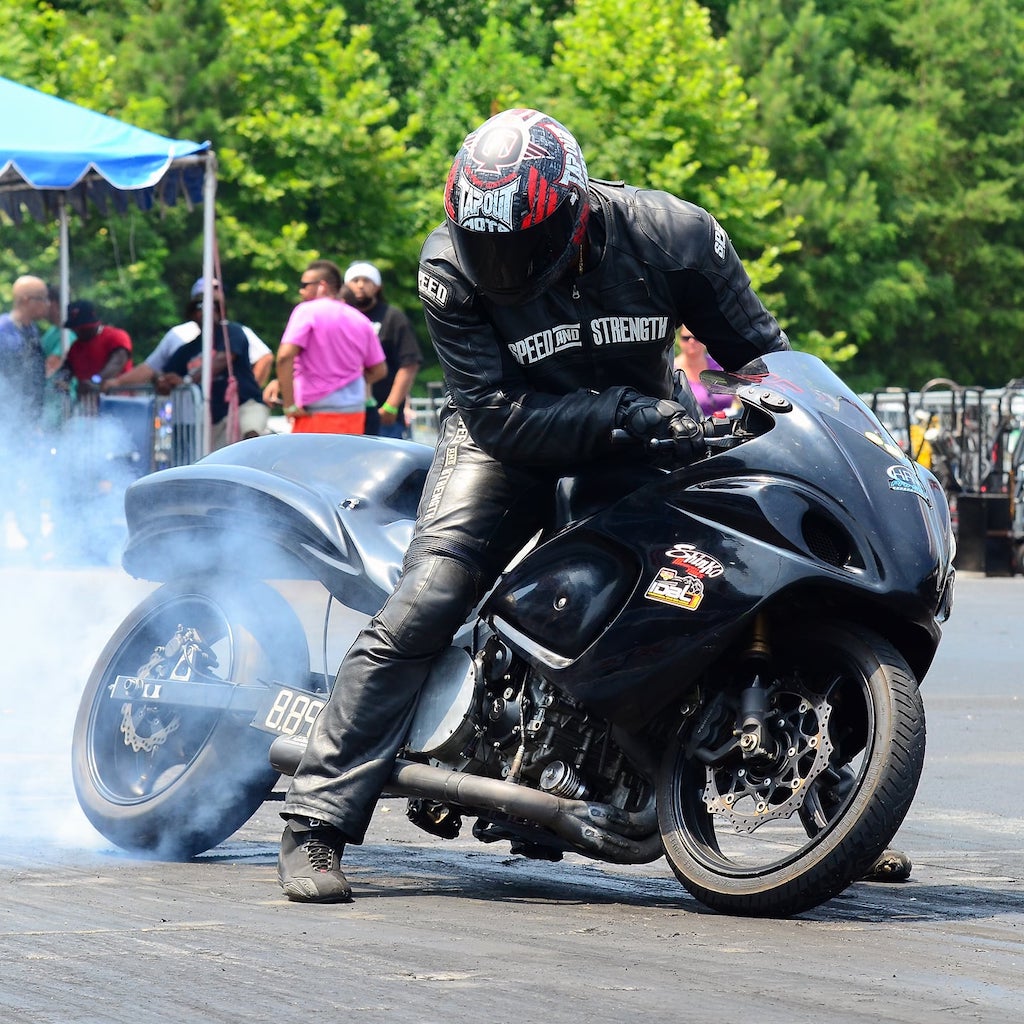 A view of a drag racer warming up their tires