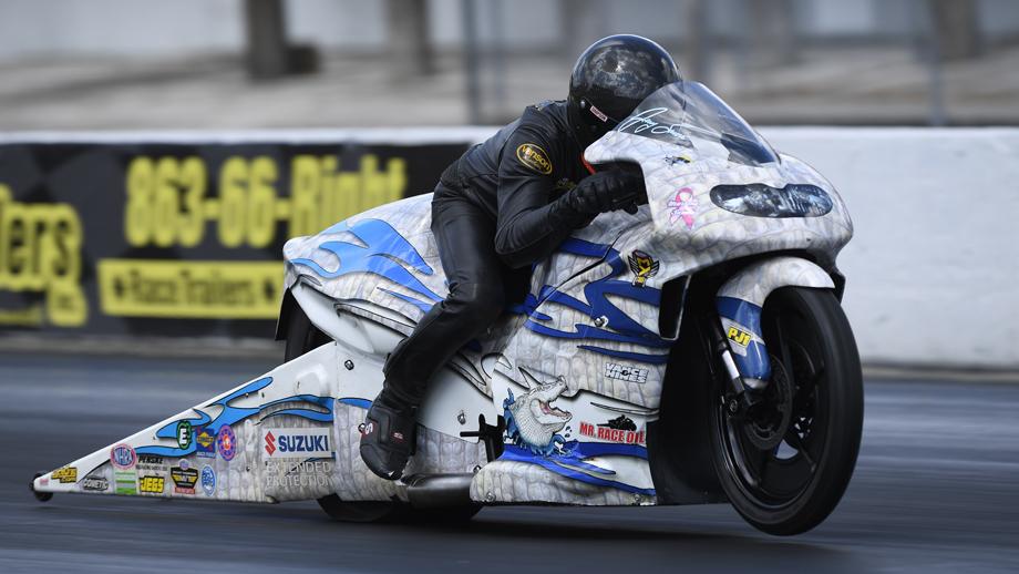 A view of a NHRA PSM drag Bike on the strip