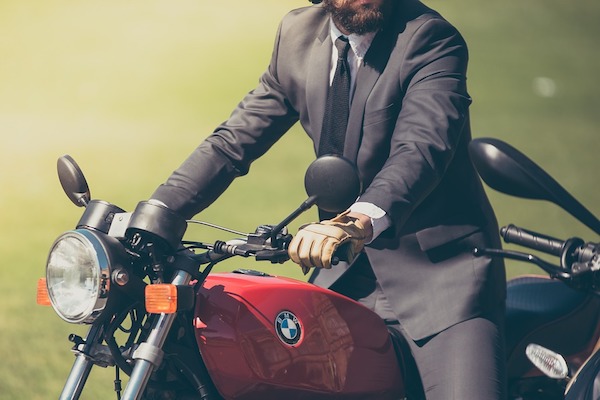 A view of a man sitting on a motorcycle