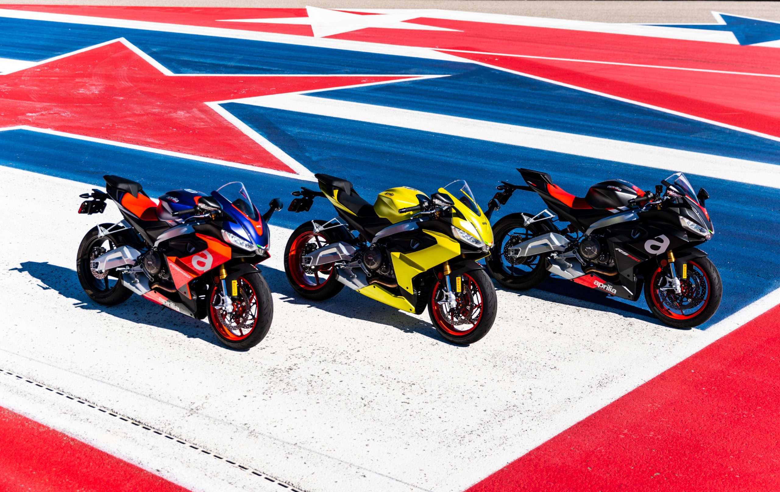 A view of the Aprilia Racer Days that will be happening between May and October of this year, with scads of chances to rub shoulders with racing icons, as well as try out the latest from Dainese, AGV, Pirelli and Aprilia's sport bike lineup.