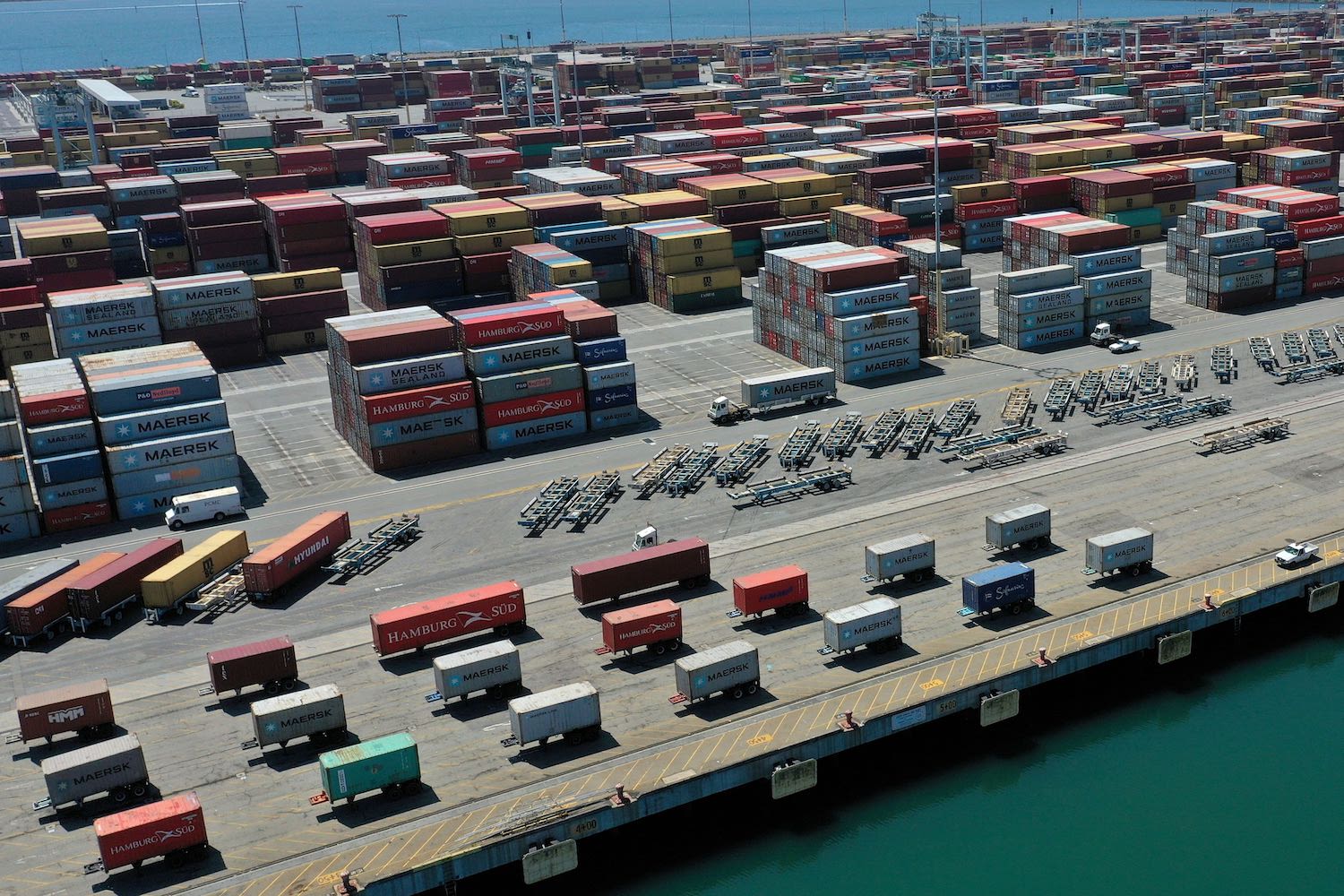 an aerial view of a shipping port from China as U.S. port backup delays deliveries