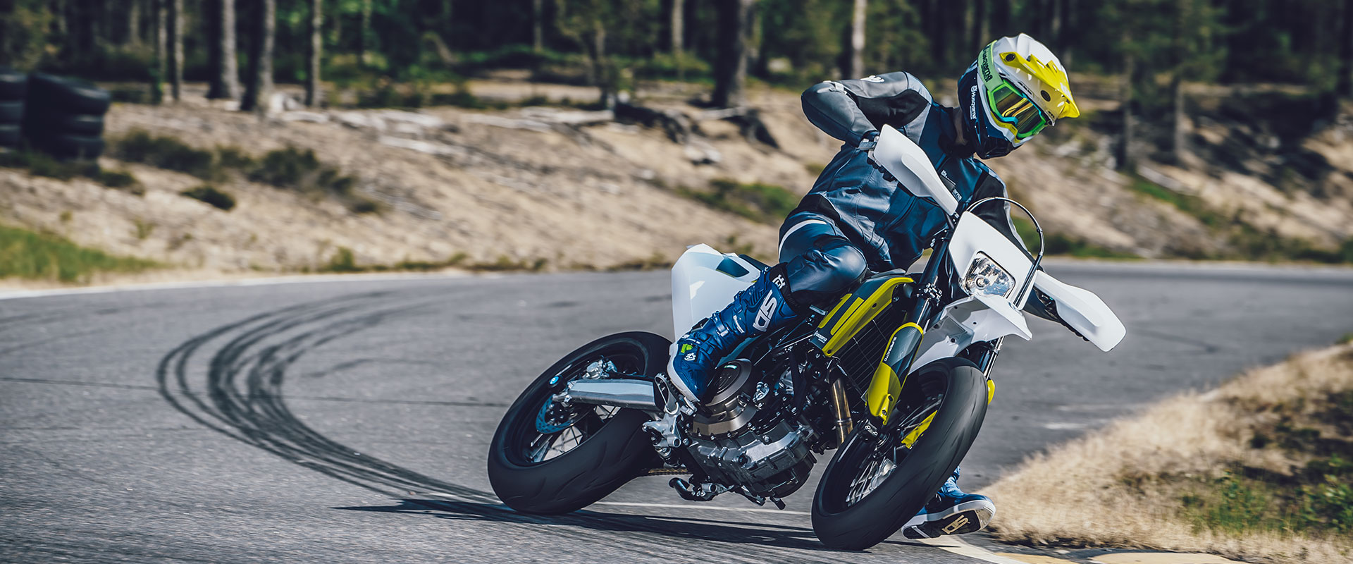 An image of a rider backing into a corner on the Husqvarna 701 Supermoto